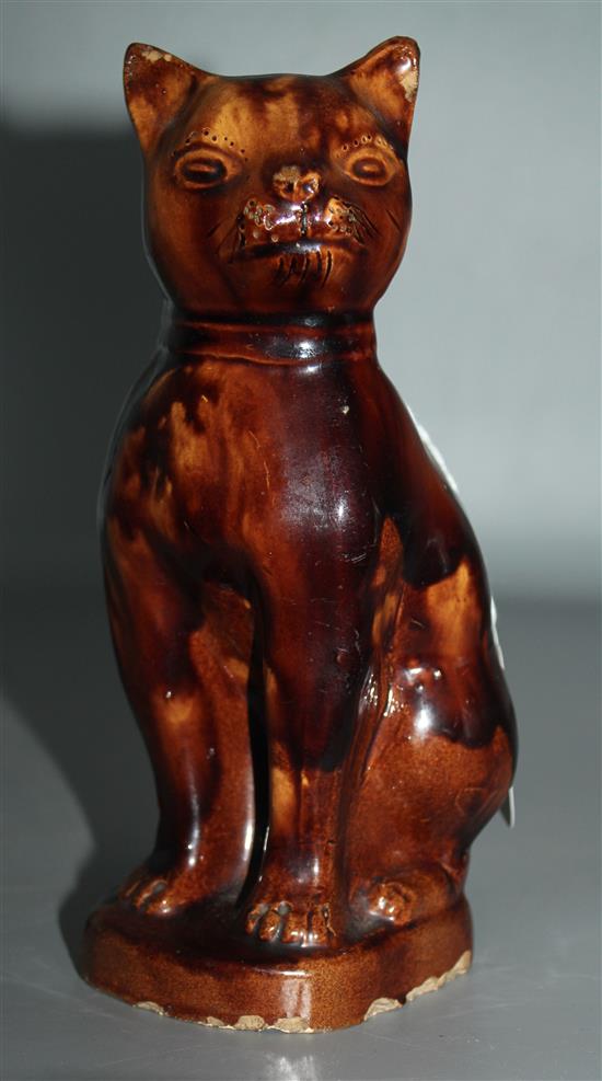 19th Century treacle-glazed pottery seated cat (faults)